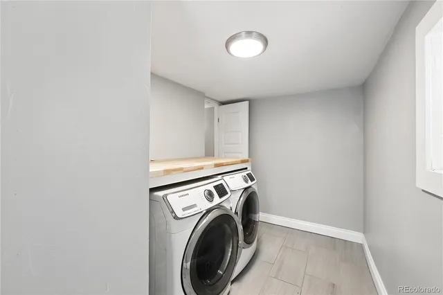 an empty room with windows and entrance