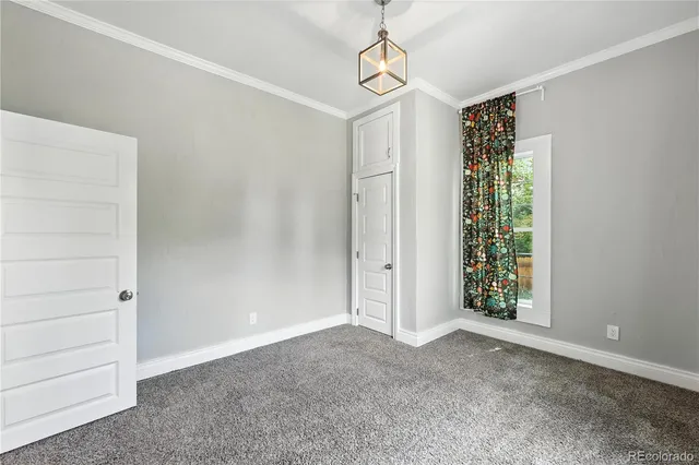 an empty room with windows and outdoor space