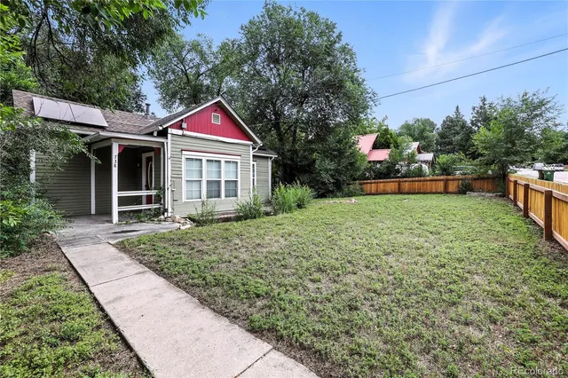 a backyard of a house with lots of green space