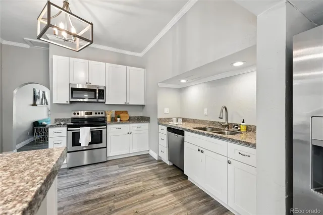 a bedroom with a bed and a large mirror