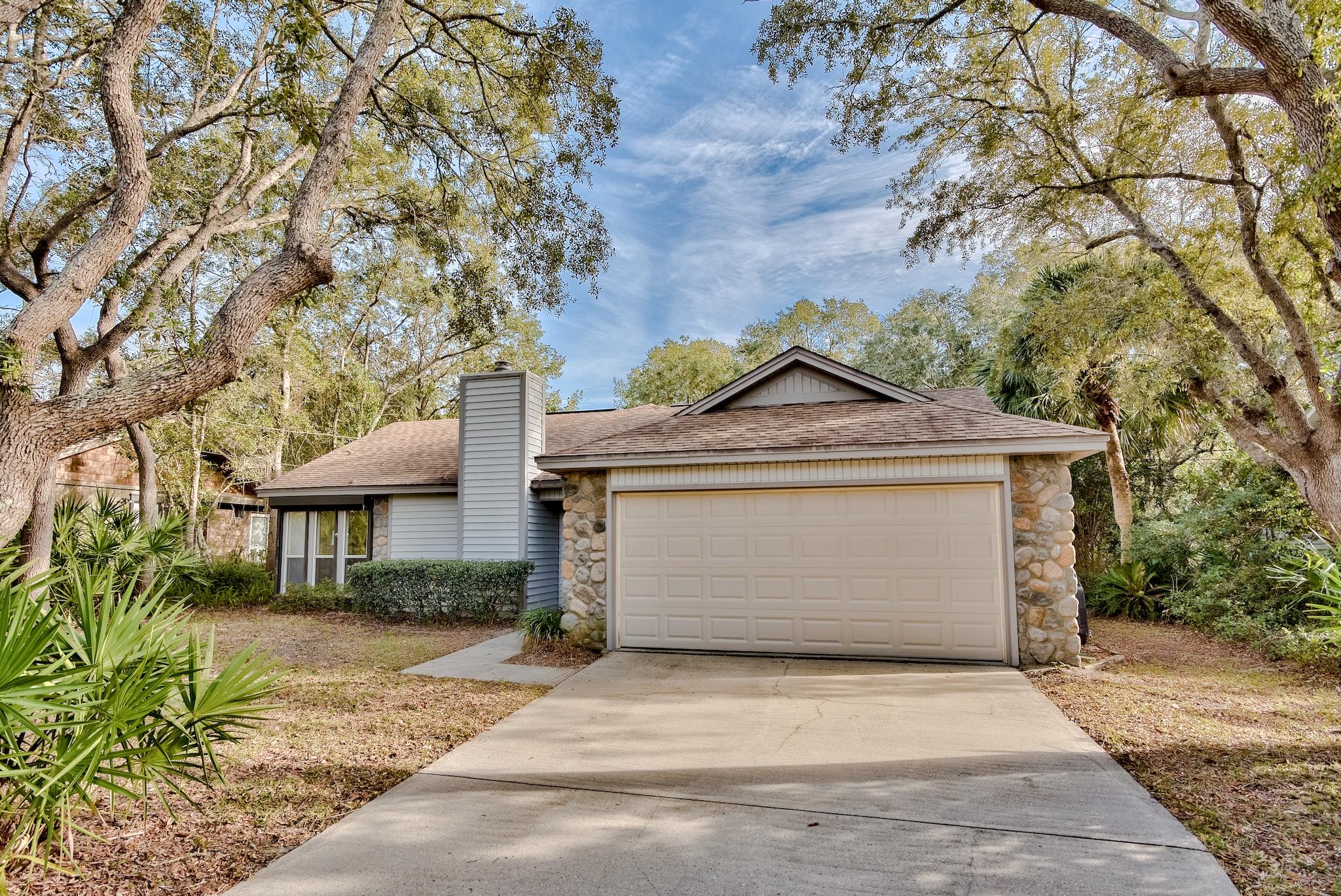 74 South Camp Creek Rd Inlet Beach Inlet Beach, FL 32461 - Photo 1 of 26 a front view of a house with a yard and garage