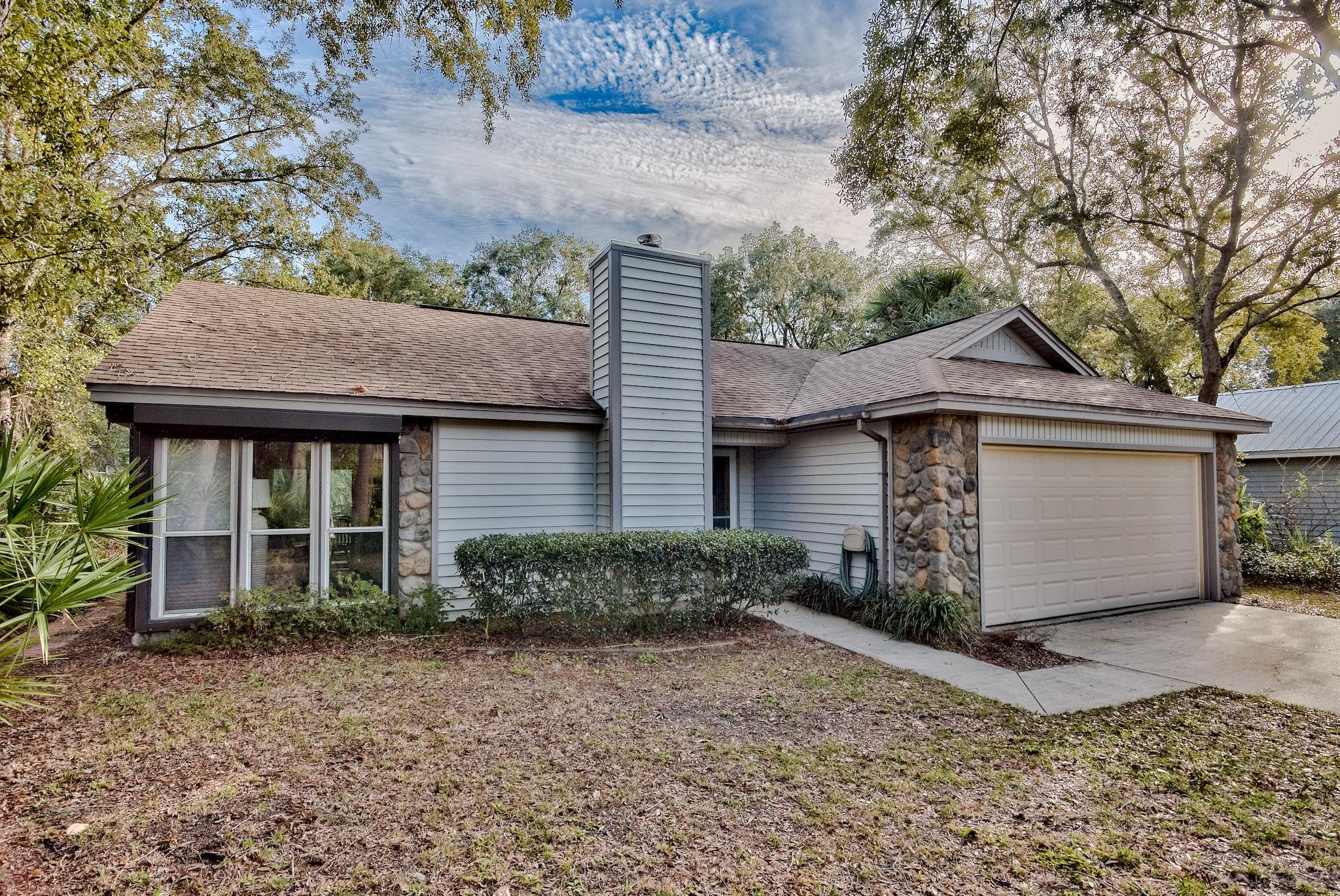 74 South Camp Creek Rd Inlet Beach Inlet Beach, FL 32461 - Photo 2 of 26 a front view of a house with a yard and garage