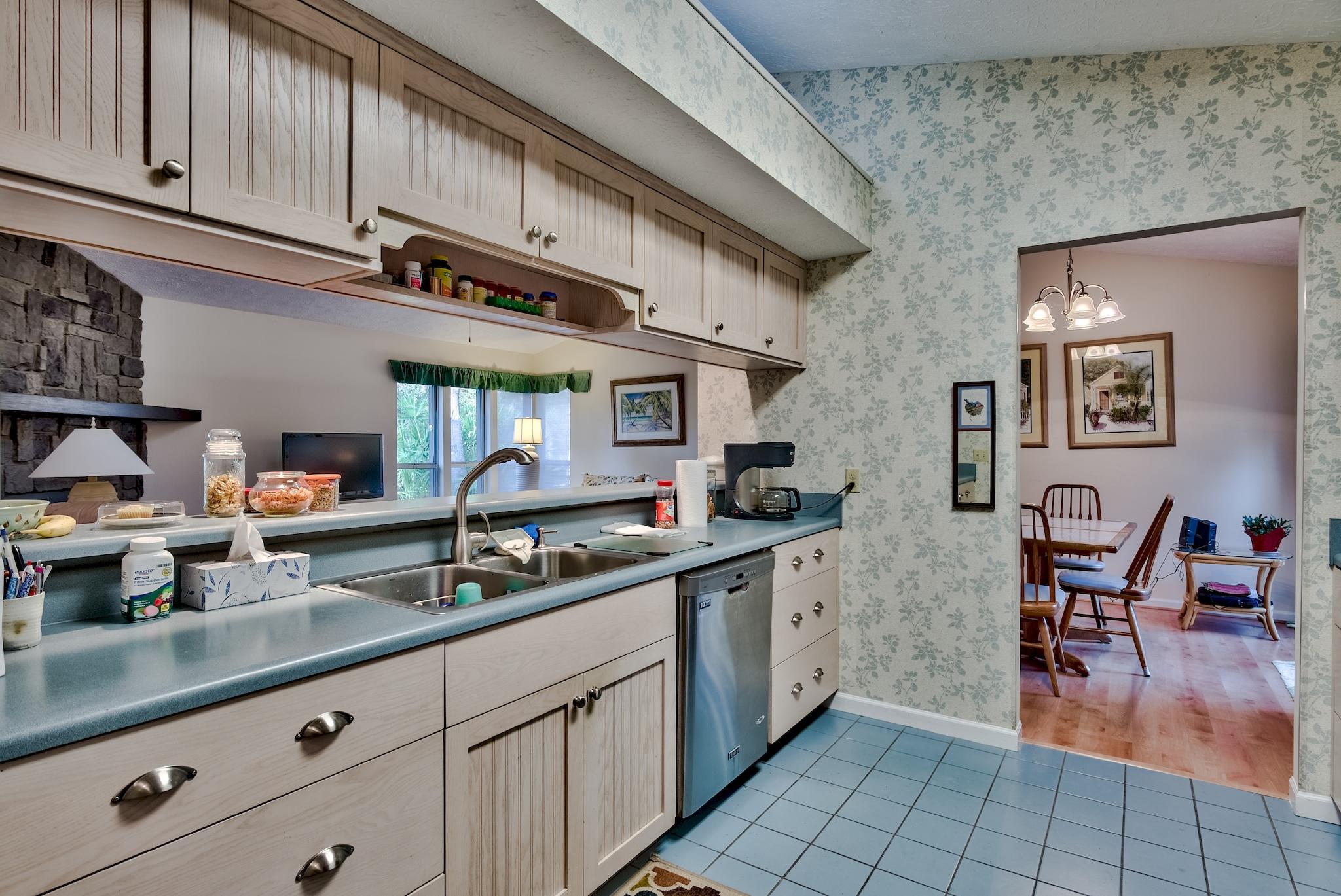 74 South Camp Creek Rd Inlet Beach Inlet Beach, FL 32461 - Photo 11 of 26 a kitchen with stainless steel appliances granite countertop a sink and cabinets