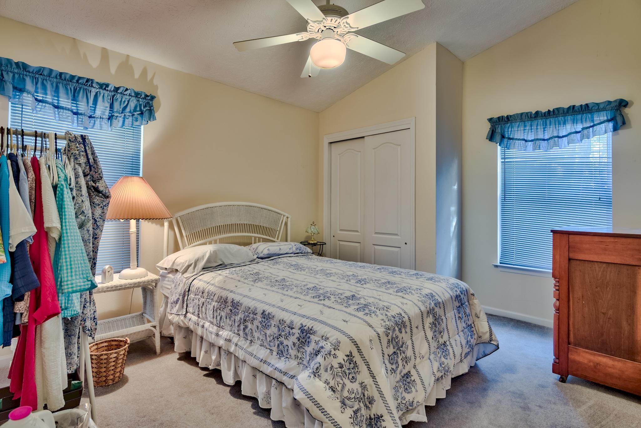 74 South Camp Creek Rd Inlet Beach Inlet Beach, FL 32461 - Photo 25 of 26 a bedroom with a bed and a chandelier