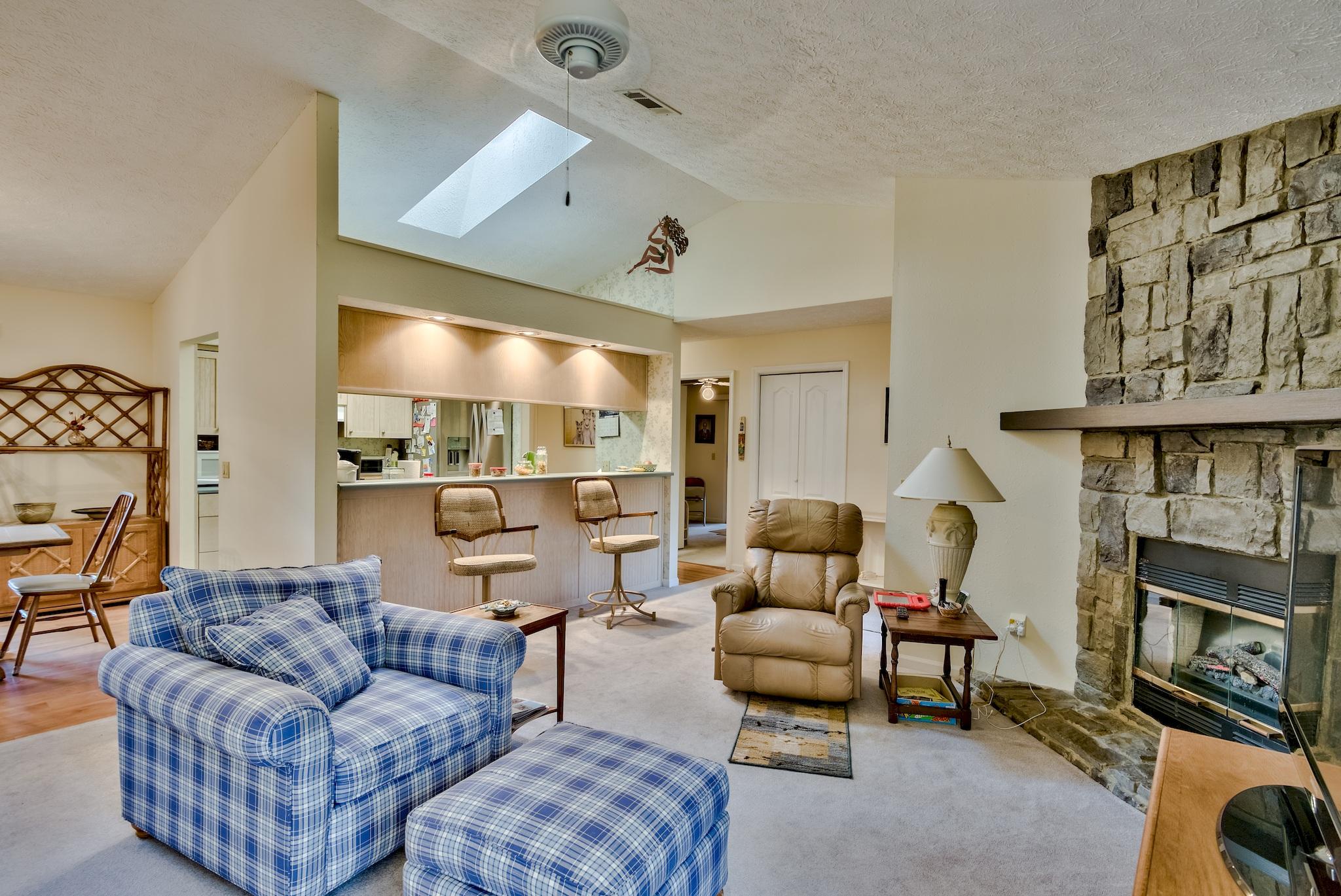 74 South Camp Creek Rd Inlet Beach Inlet Beach, FL 32461 - Photo 5 of 26 a living room with furniture and a fireplace