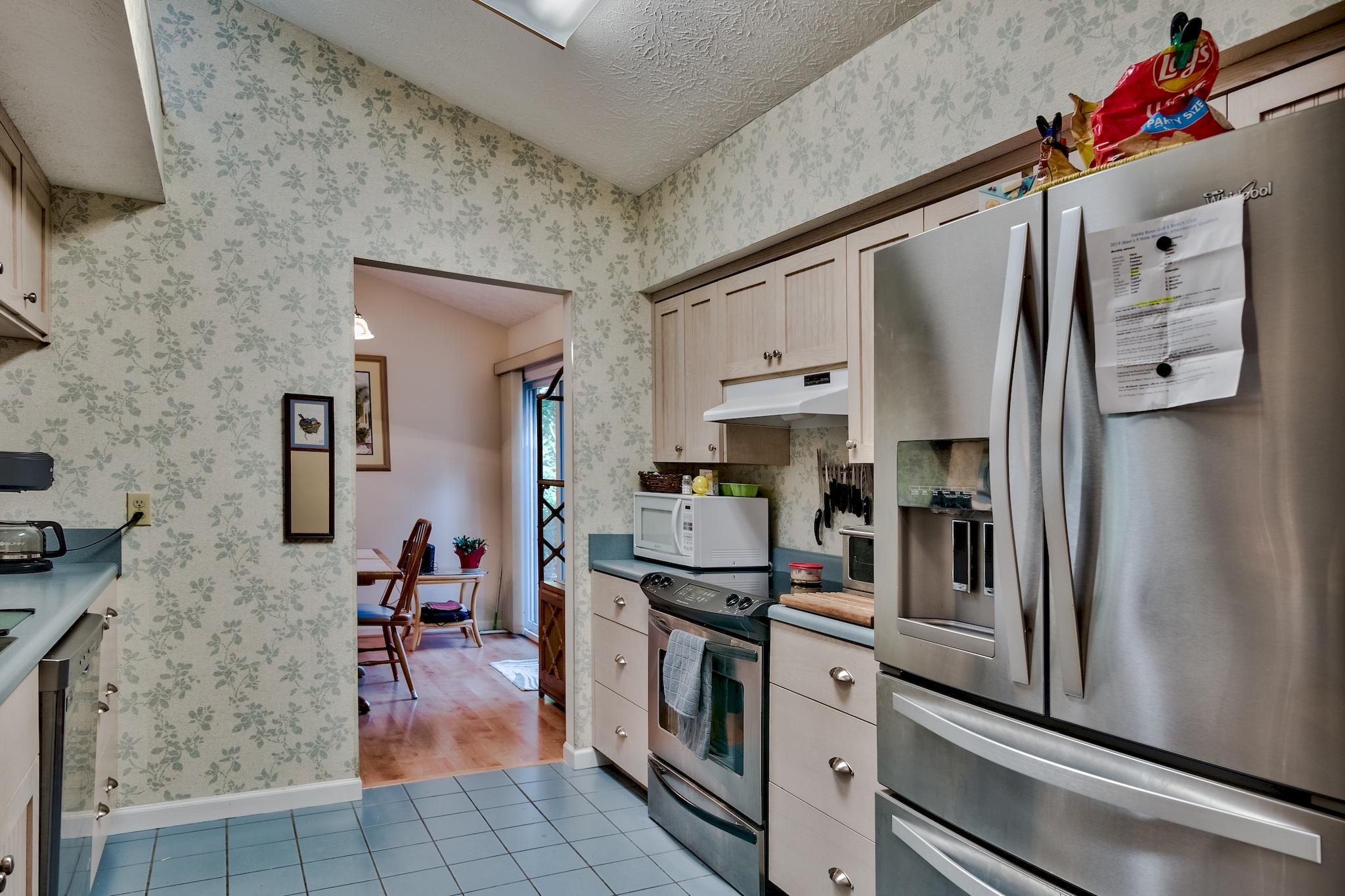 74 South Camp Creek Rd Inlet Beach Inlet Beach, FL 32461 - Photo 10 of 26 a kitchen with stainless steel appliances a refrigerator sink and cabinets