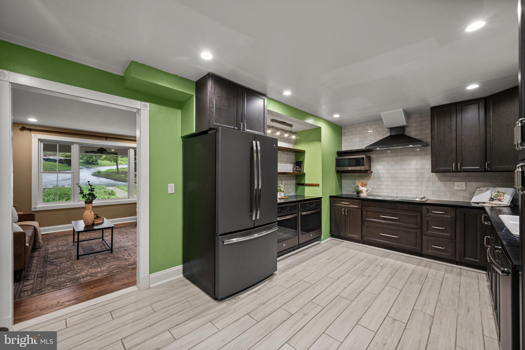 10902 Hammond Drive Laurel, MD 20723 - Photo 11 of 48 a kitchen with stainless steel appliances granite countertop a refrigerator and a stove top oven