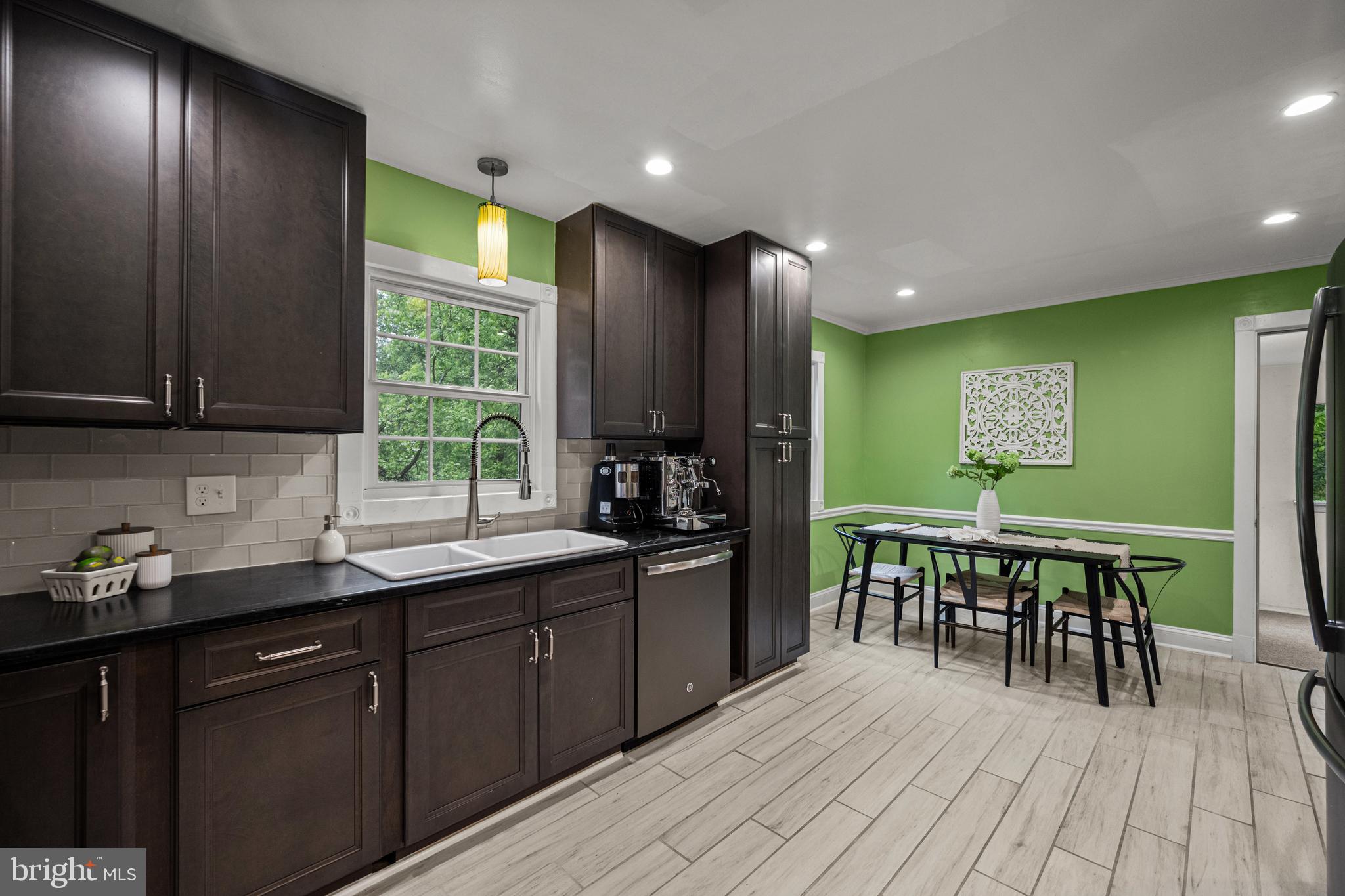 10902 Hammond Drive Laurel, MD 20723 - Photo 14 of 48 a kitchen with stainless steel appliances granite countertop sink stove and cabinets