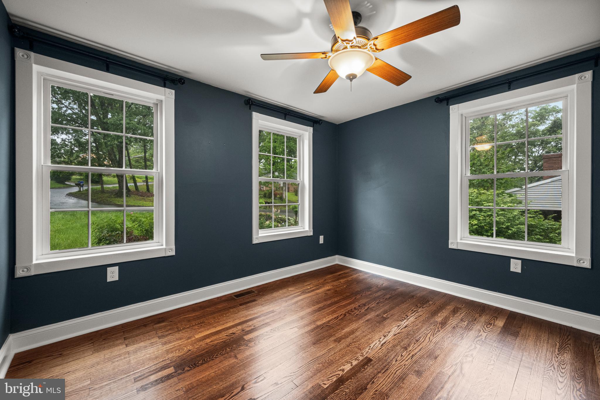 10902 Hammond Drive Laurel, MD 20723 - Photo 21 of 48 a view of an empty room with wooden floor and a window