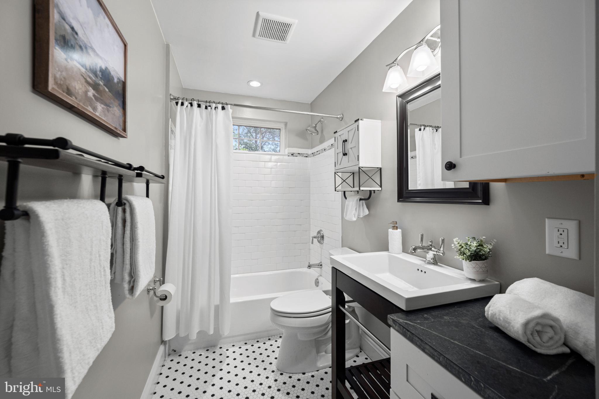 10902 Hammond Drive Laurel, MD 20723 - Photo 25 of 48 a bathroom with a granite countertop sink toilet and shower