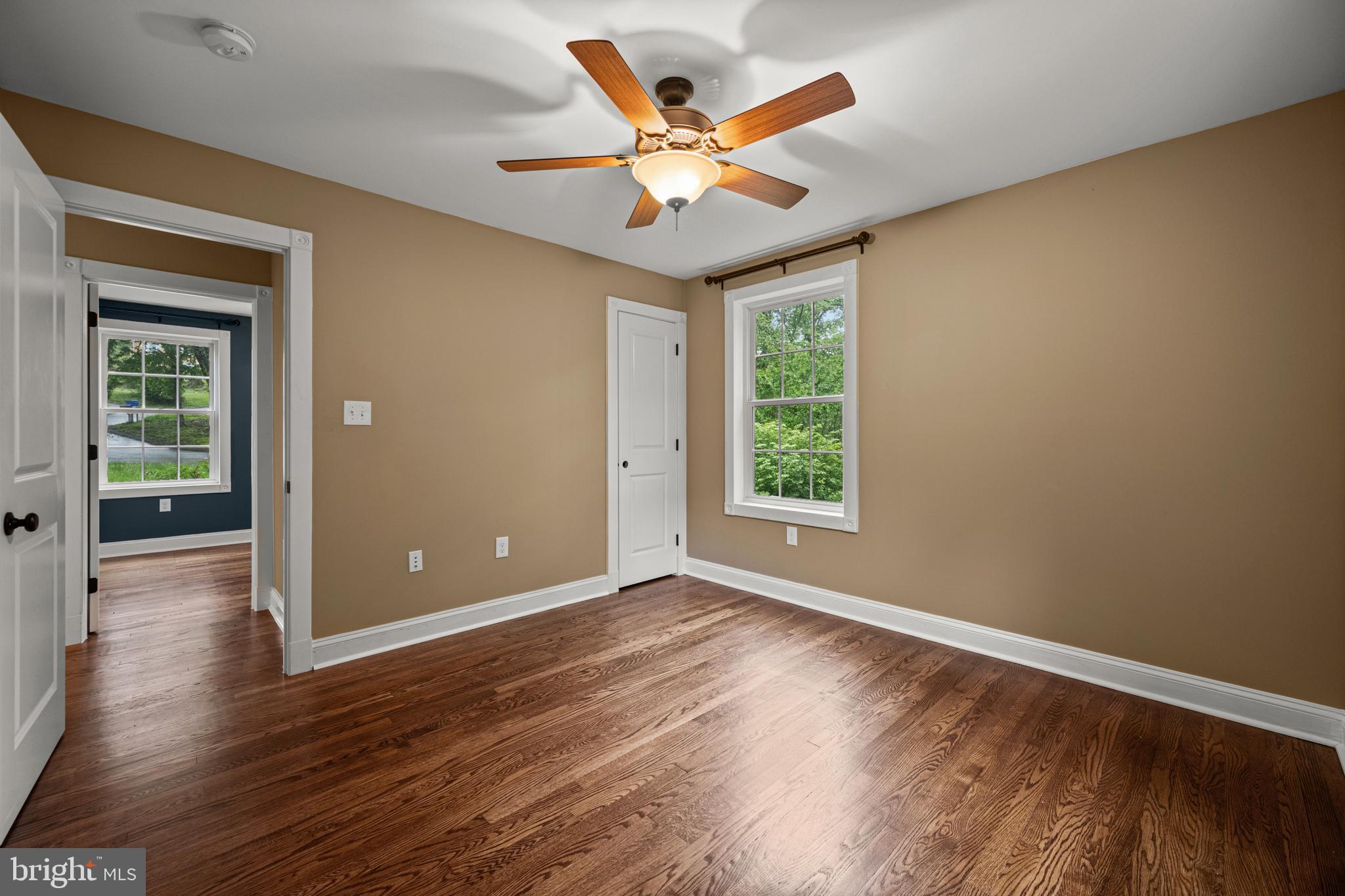 10902 Hammond Drive Laurel, MD 20723 - Photo 27 of 48 a view of an empty room with wooden floor and a window