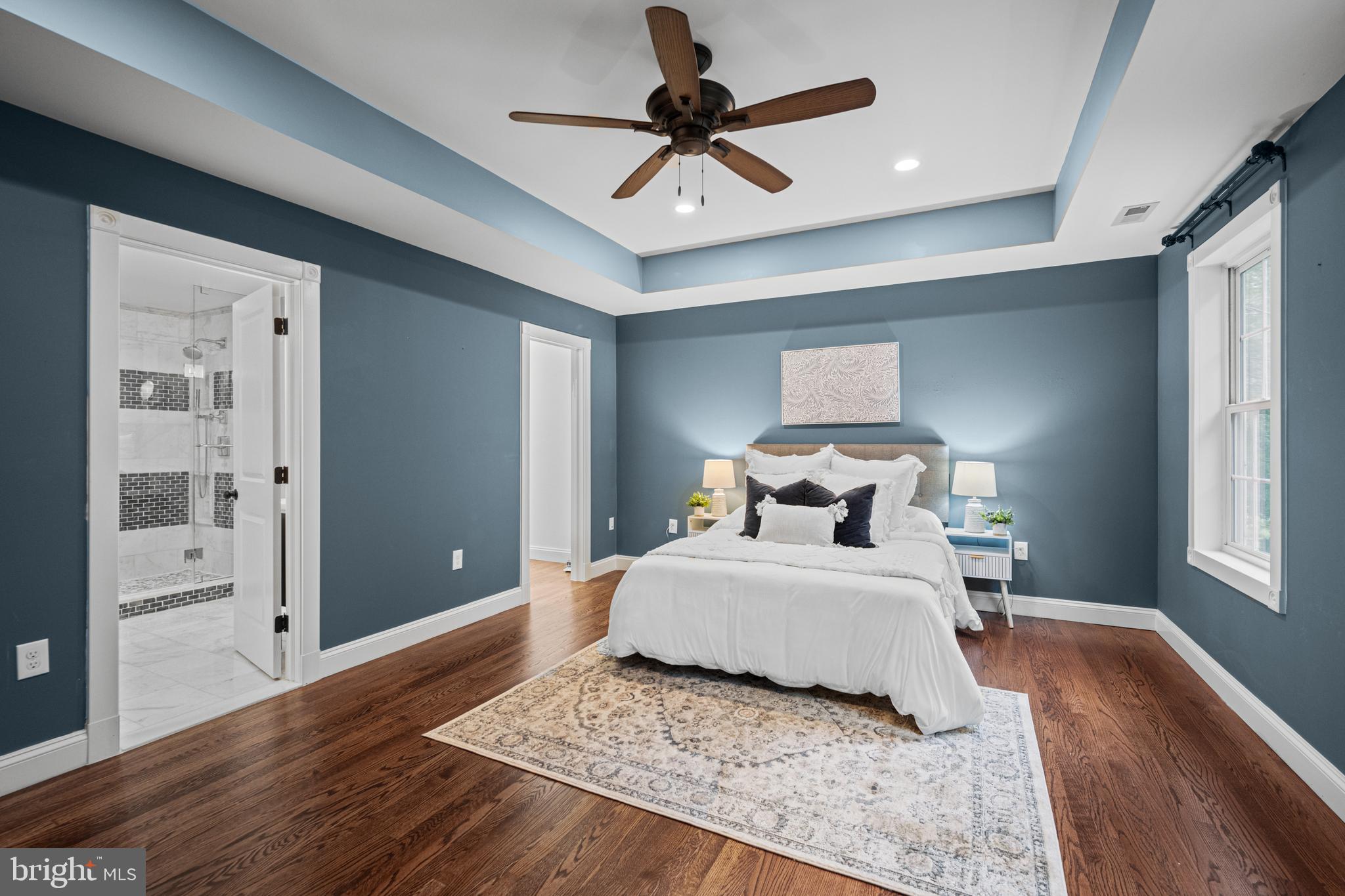 10902 Hammond Drive Laurel, MD 20723 - Photo 3 of 48 a bedroom with a bed and wooden floor