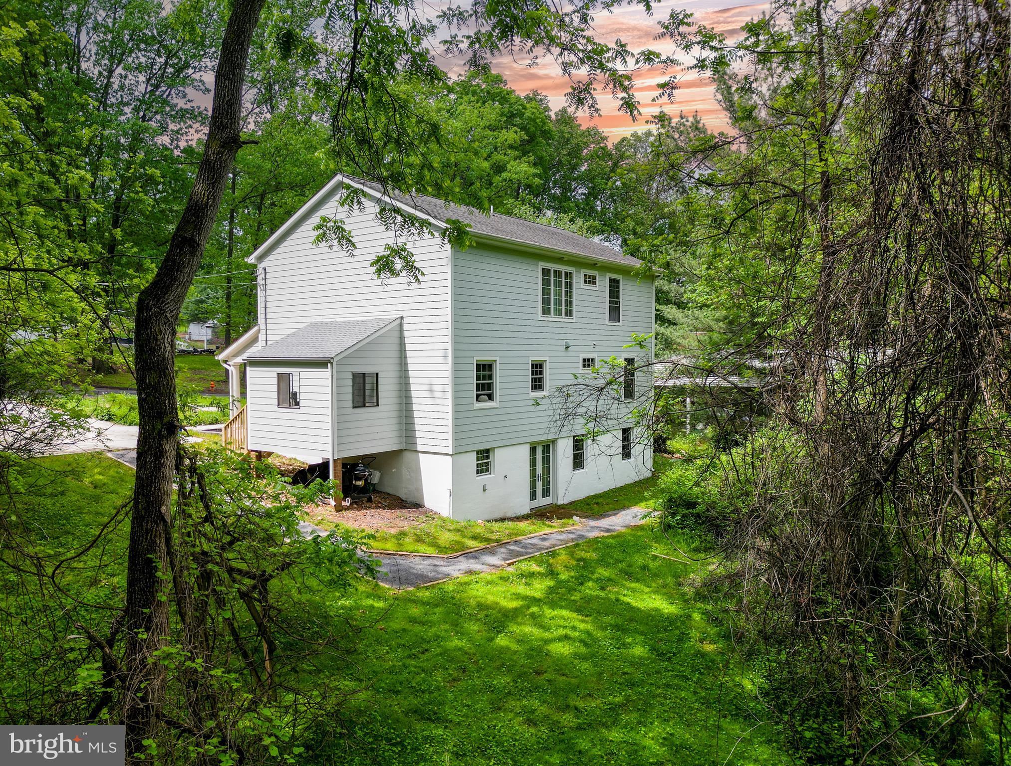 10902 Hammond Drive Laurel, MD 20723 - Photo 32 of 48 a view of a house with backyard and garden