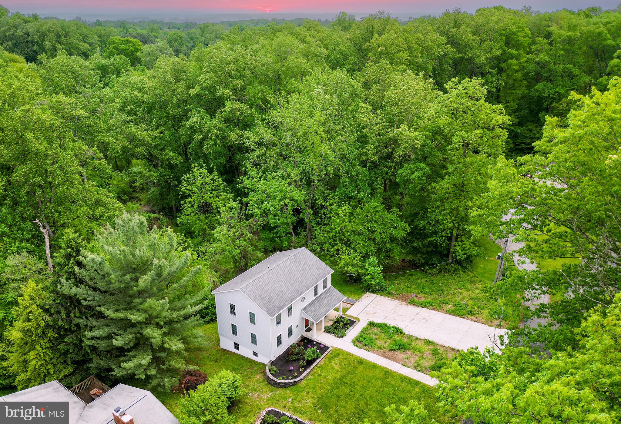 10902 Hammond Drive Laurel, MD 20723 - Photo 34 of 48 an aerial view of a house with yard and outdoor seating