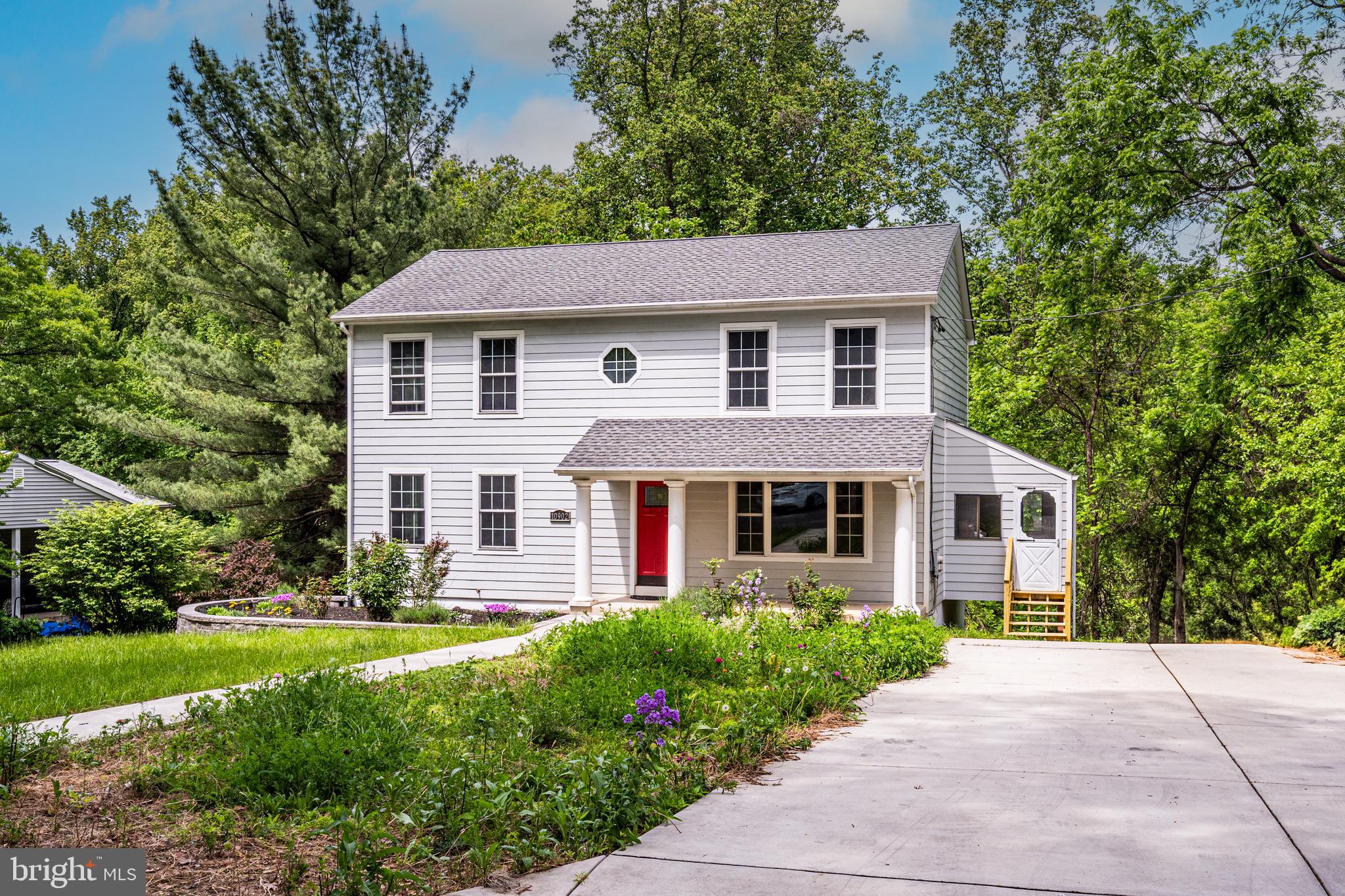 10902 Hammond Drive Laurel, MD 20723 - Photo 38 of 48 a front view of a house with garden