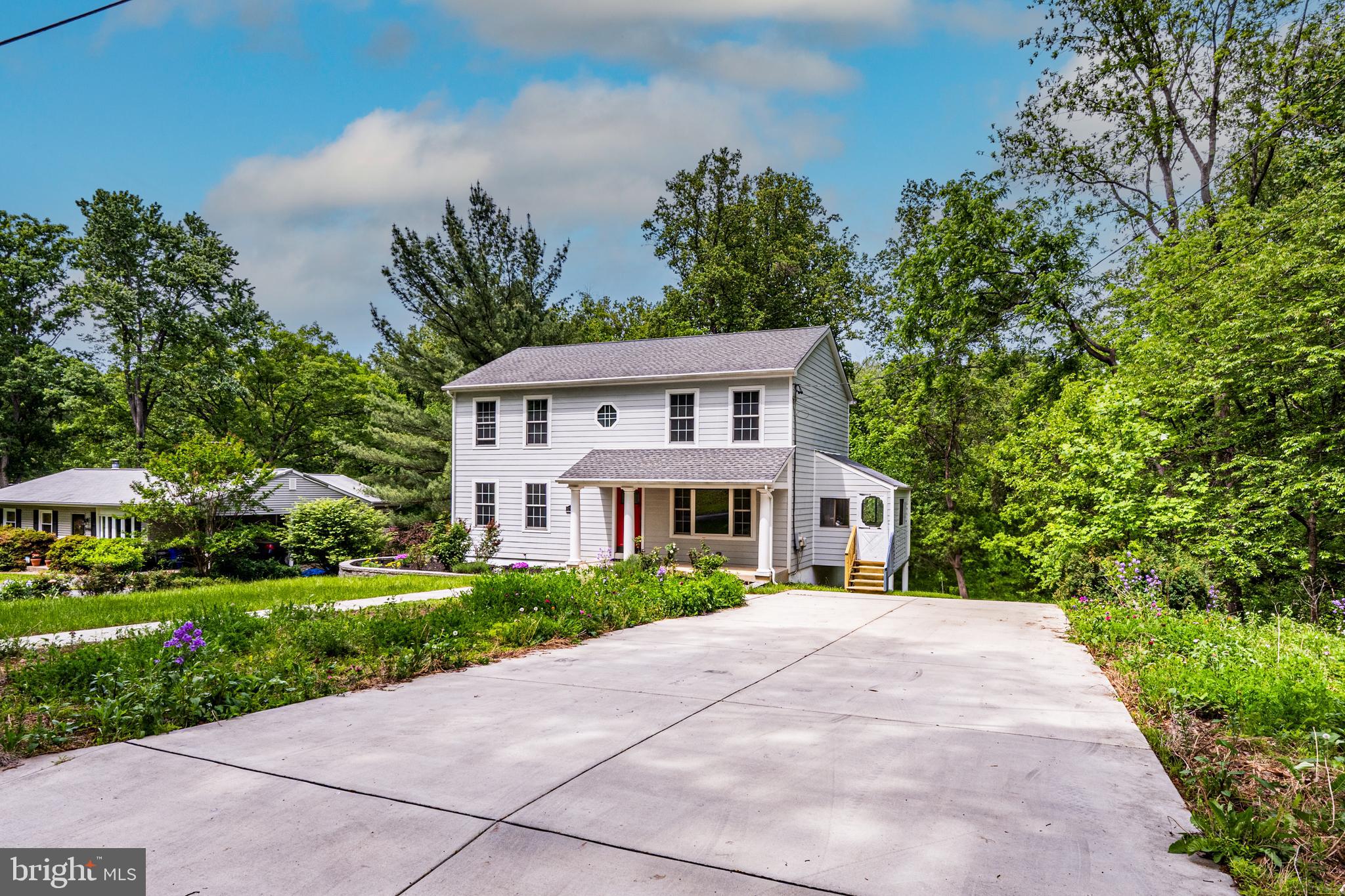 10902 Hammond Drive Laurel, MD 20723 - Photo 39 of 48 a front view of a house with a yard and potted plants