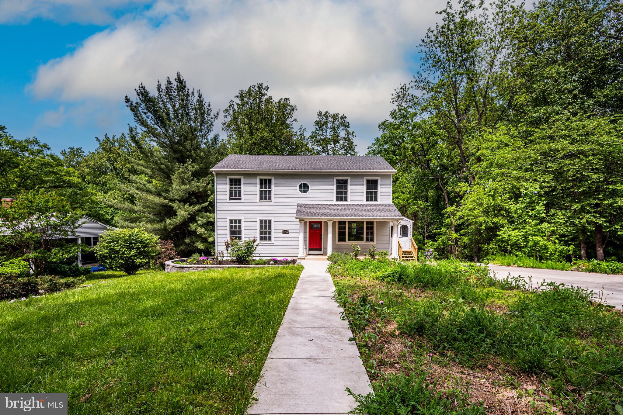 10902 Hammond Drive Laurel, MD 20723 - Photo 40 of 48 a front view of a house with a yard