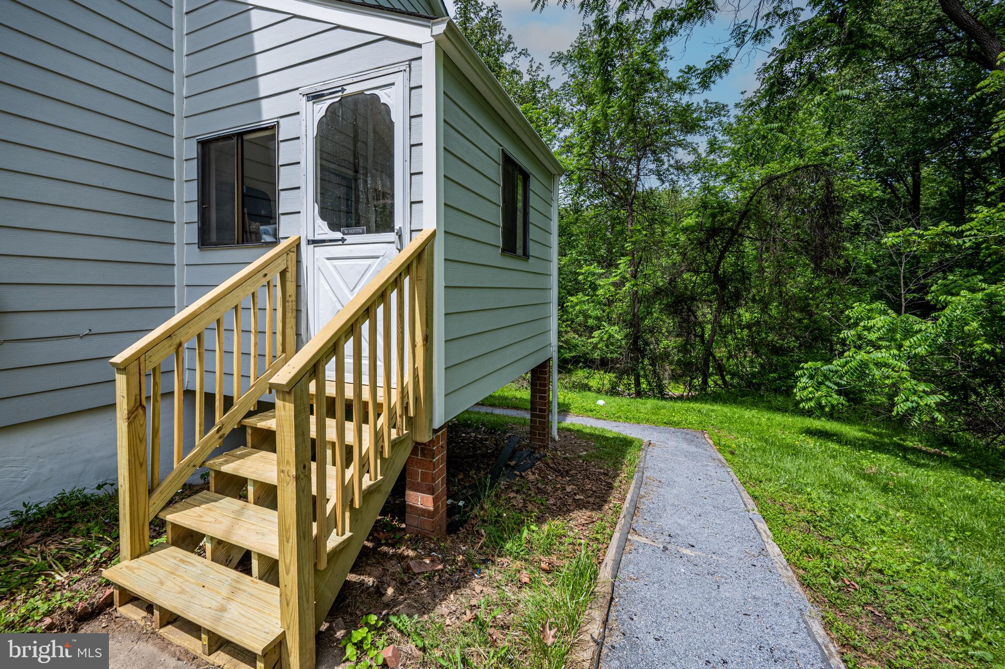 10902 Hammond Drive Laurel, MD 20723 - Photo 41 of 48 a view of a house with backyard and trees