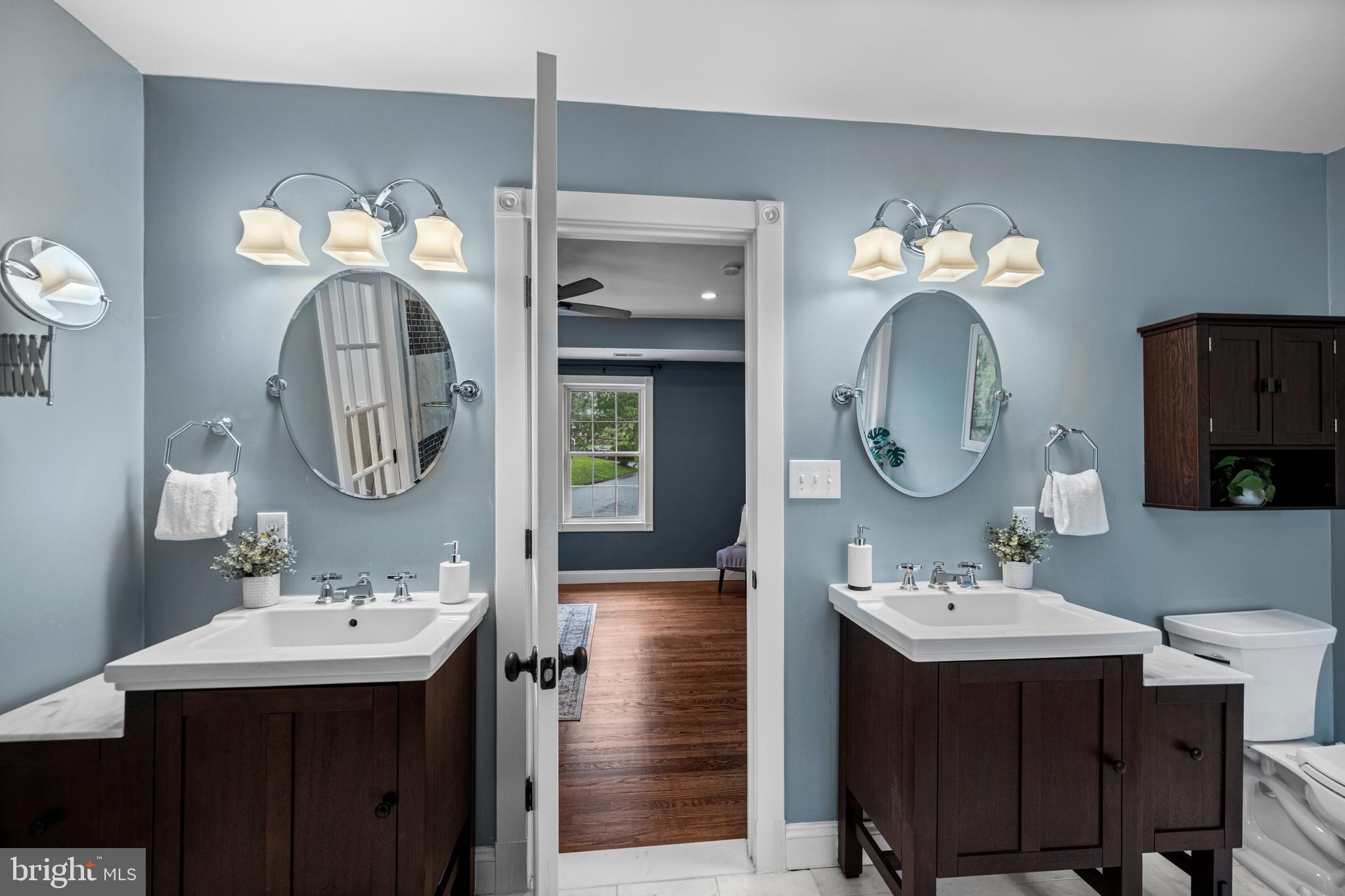 10902 Hammond Drive Laurel, MD 20723 - Photo 7 of 48 a bathroom with a sink vanity and a mirror