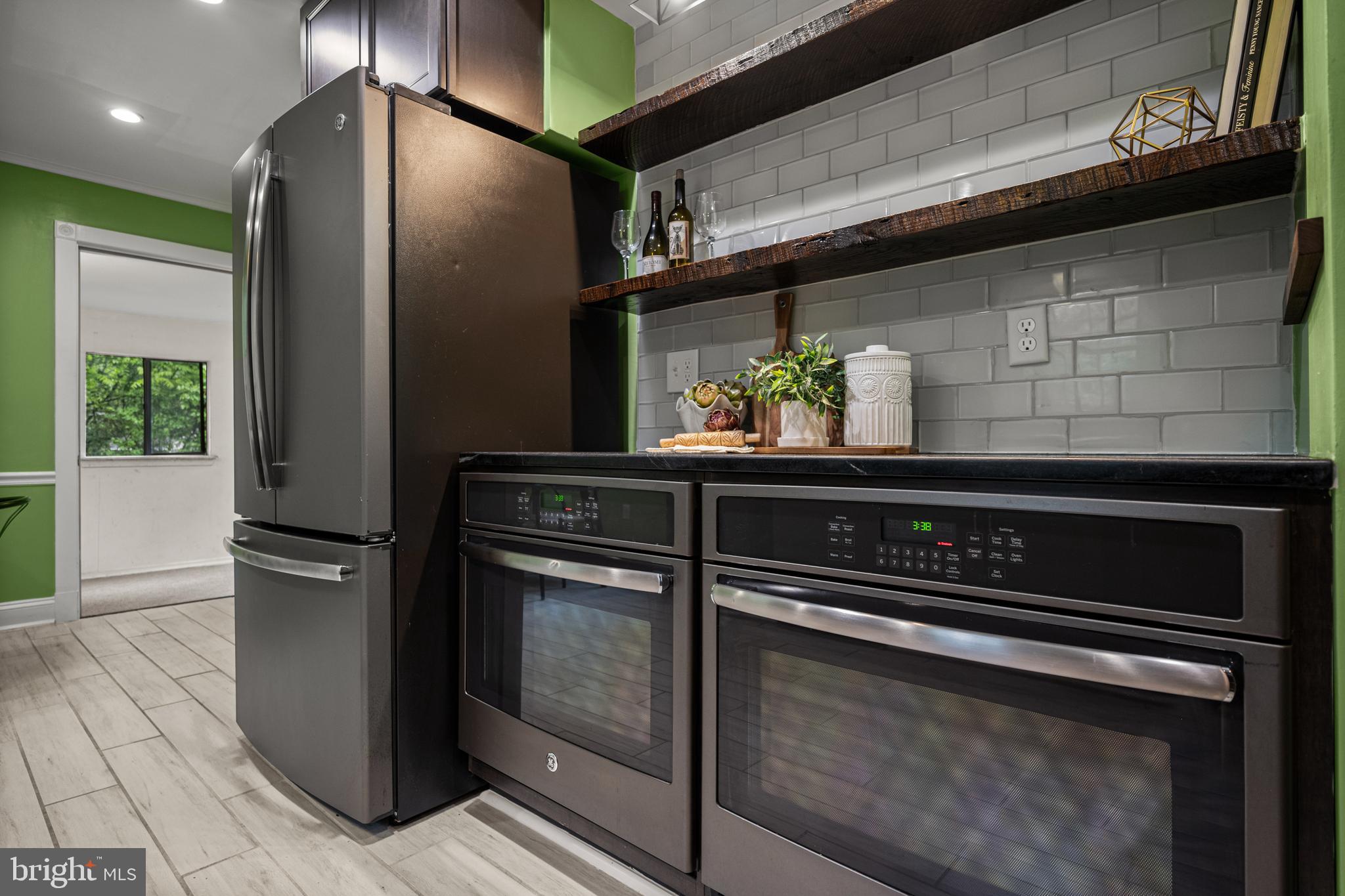 10902 Hammond Drive Laurel, MD 20723 - Photo 10 of 48 a kitchen with a stove and a refrigerator