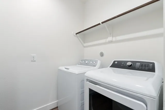 a utility room with dryer and washer