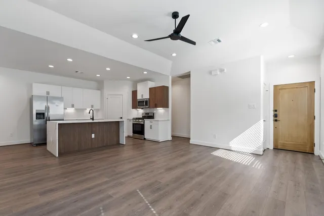 a view of kitchen with wooden floor and window
