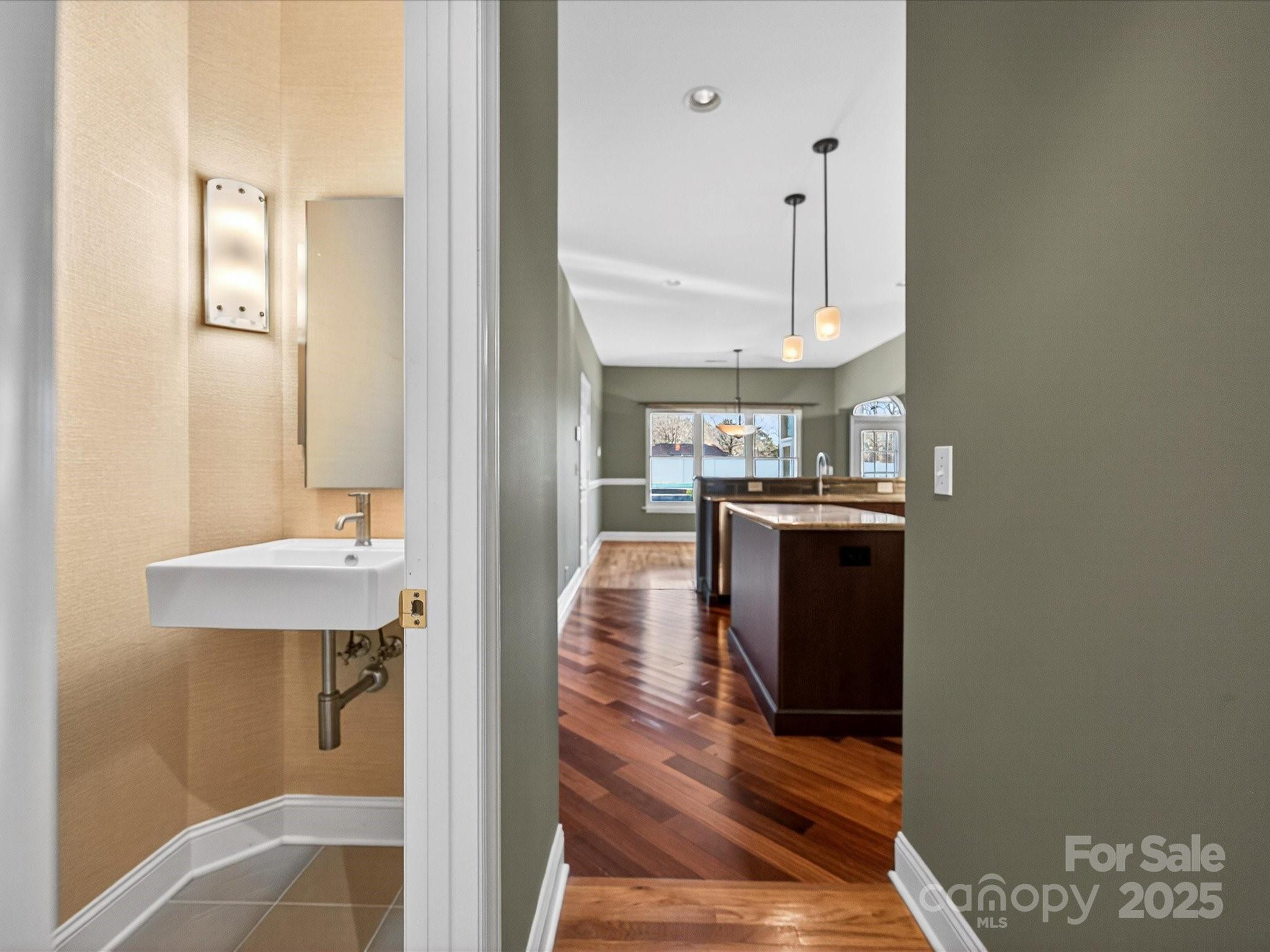 153 Collingswood Road Mooresville, NC 28117 - Photo 16 of 28 a view of a kitchen from the hallway