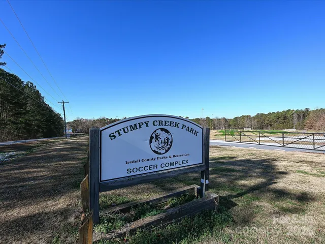 a view of a sign board with yard