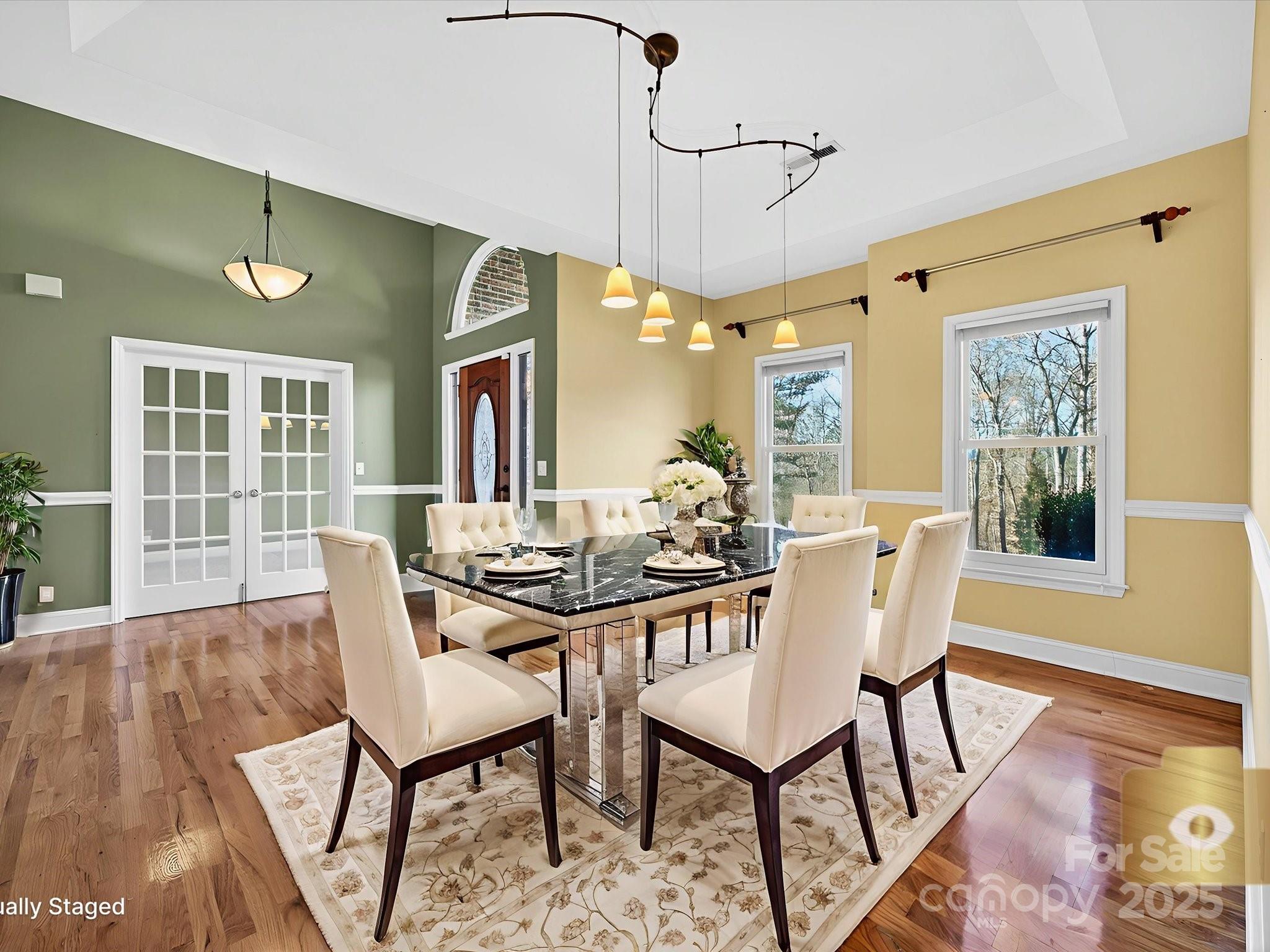 153 Collingswood Road Mooresville, NC 28117 - Photo 8 of 28 a view of a dining room with furniture window and wooden floor