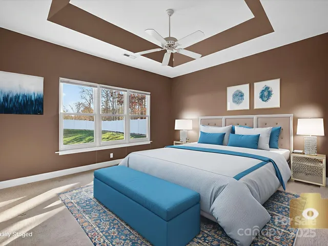 a bed room with a bed and a large window