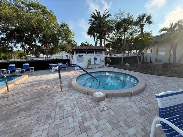 a view of a swimming pool with a sitting space