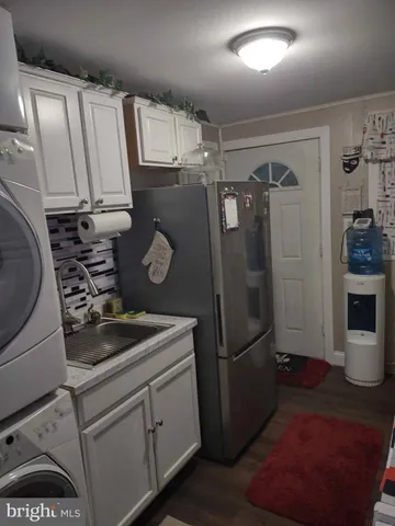 a kitchen with a stove and a microwave oven