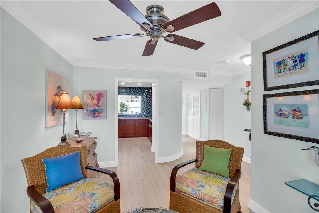 5914 South River Run Drive, Unit 5914 Sebastian, FL 32958 - Photo 11 of 36 a living room with furniture a ceiling fan and a rug