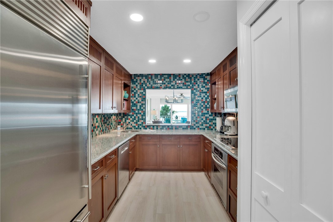 5914 South River Run Drive, Unit 5914 Sebastian, FL 32958 - Photo 12 of 36 a hallway with an outdoor view of the kitchen