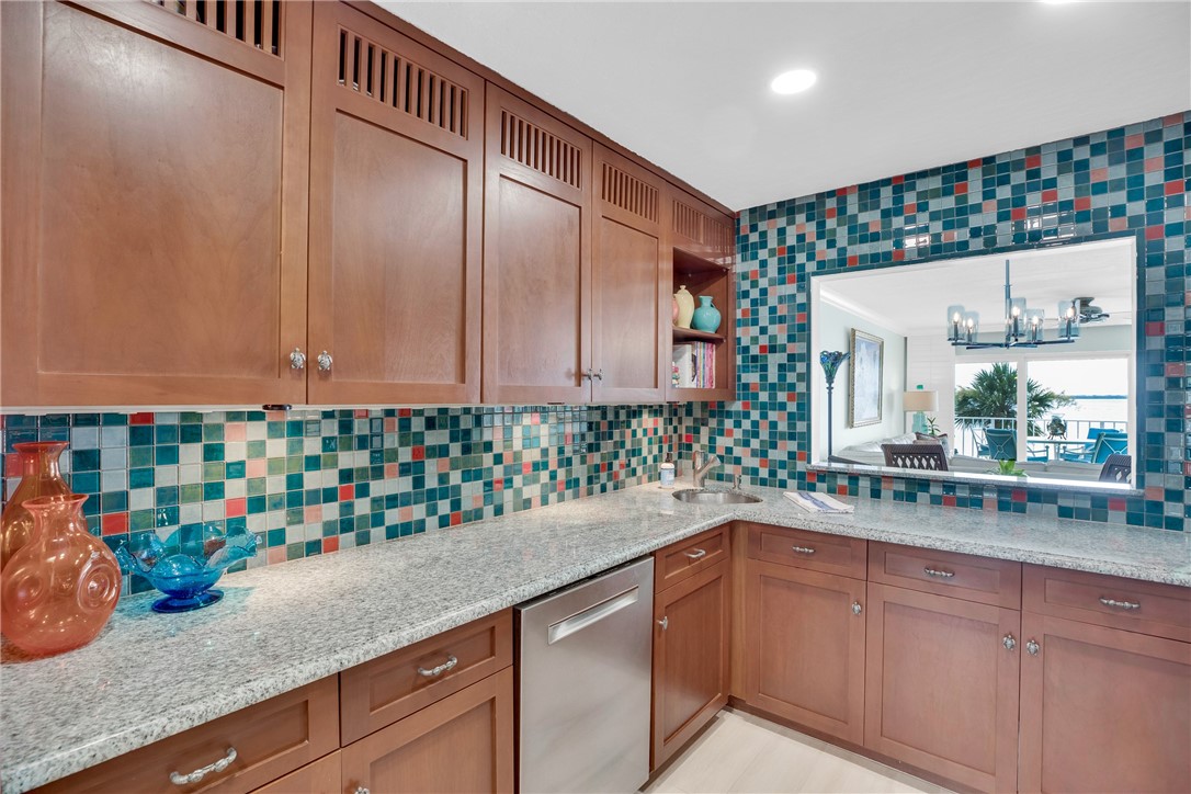 5914 South River Run Drive, Unit 5914 Sebastian, FL 32958 - Photo 14 of 36 a kitchen with a sink and cabinets