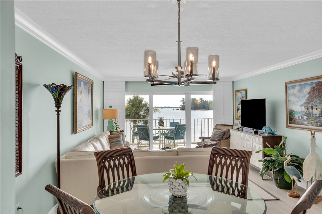 5914 South River Run Drive, Unit 5914 Sebastian, FL 32958 - Photo 15 of 36 a view of a livingroom with furniture window and wooden floor