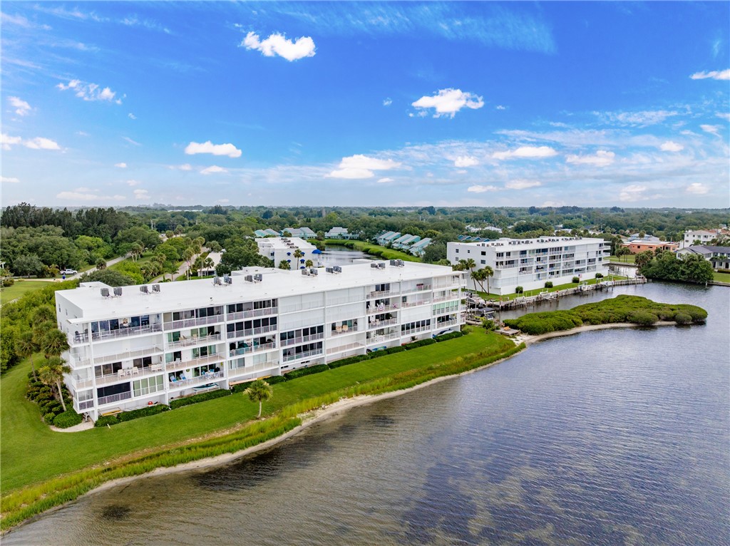 5914 South River Run Drive, Unit 5914 Sebastian, FL 32958 - Photo 2 of 36 a view of a city with tall buildings