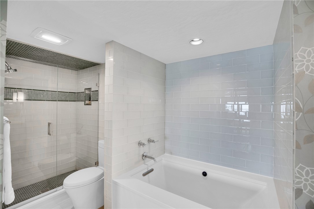 5914 South River Run Drive, Unit 5914 Sebastian, FL 32958 - Photo 22 of 36 a bathroom with a shower and a toilet