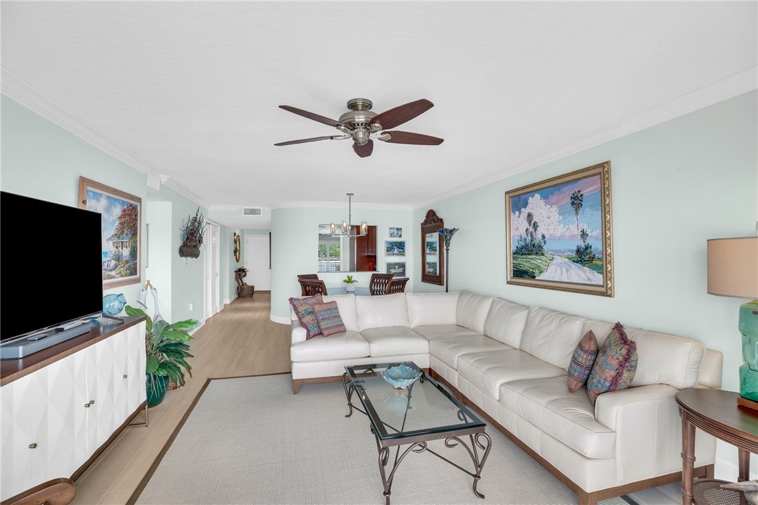 5914 South River Run Drive, Unit 5914 Sebastian, FL 32958 - Photo 25 of 36 a living room with furniture and a flat screen tv