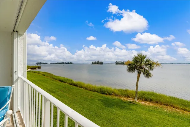 a view of a lake with a big yard
