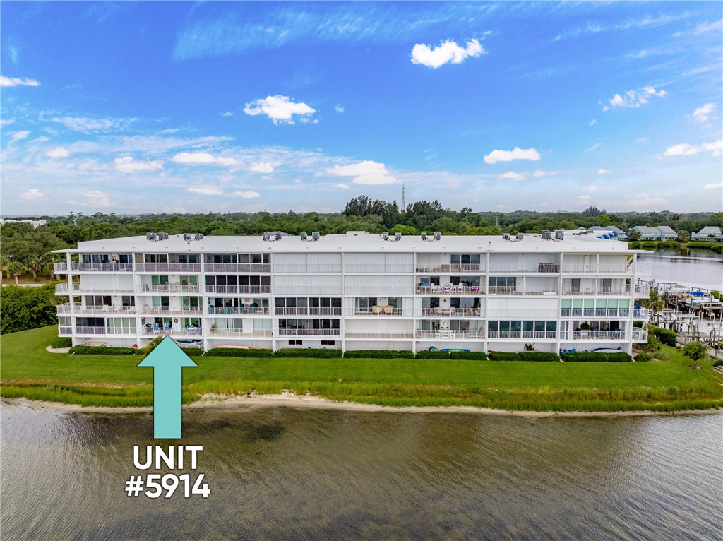 5914 South River Run Drive, Unit 5914 Sebastian, FL 32958 - Photo 3 of 36 a view of a city with tall buildings