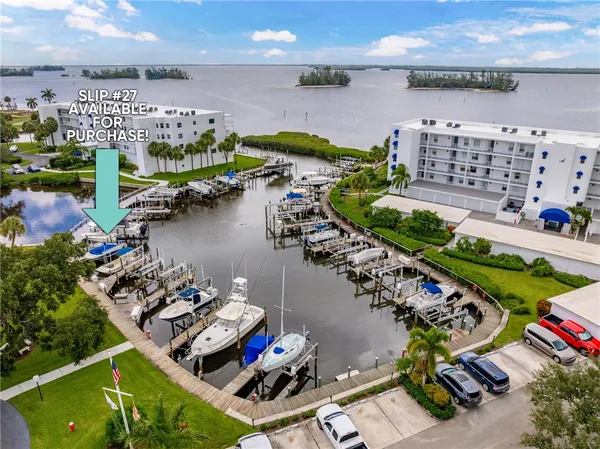 an aerial view of a house with a lake view