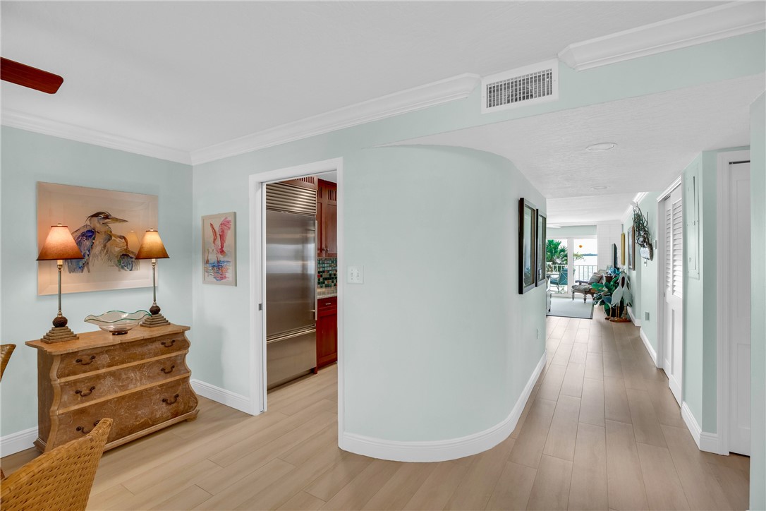 5914 South River Run Drive, Unit 5914 Sebastian, FL 32958 - Photo 8 of 36 a view of a hallway with closet and wooden floor