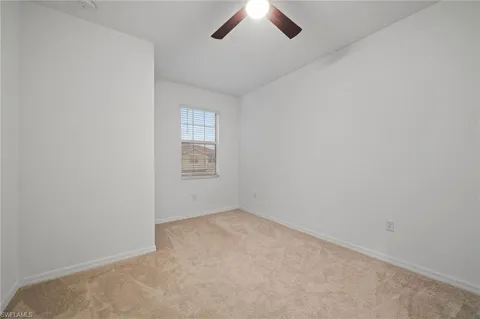 an empty room with a empty space and windows