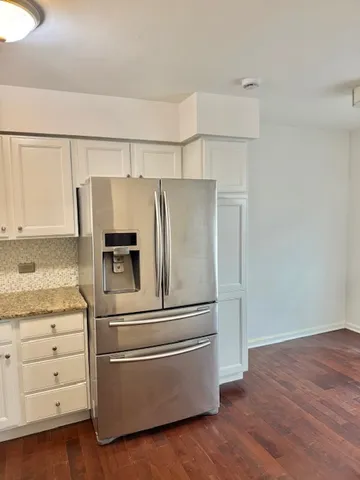 a kitchen with appliances and cabinets
