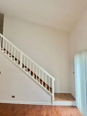 a view of an empty room with stairs