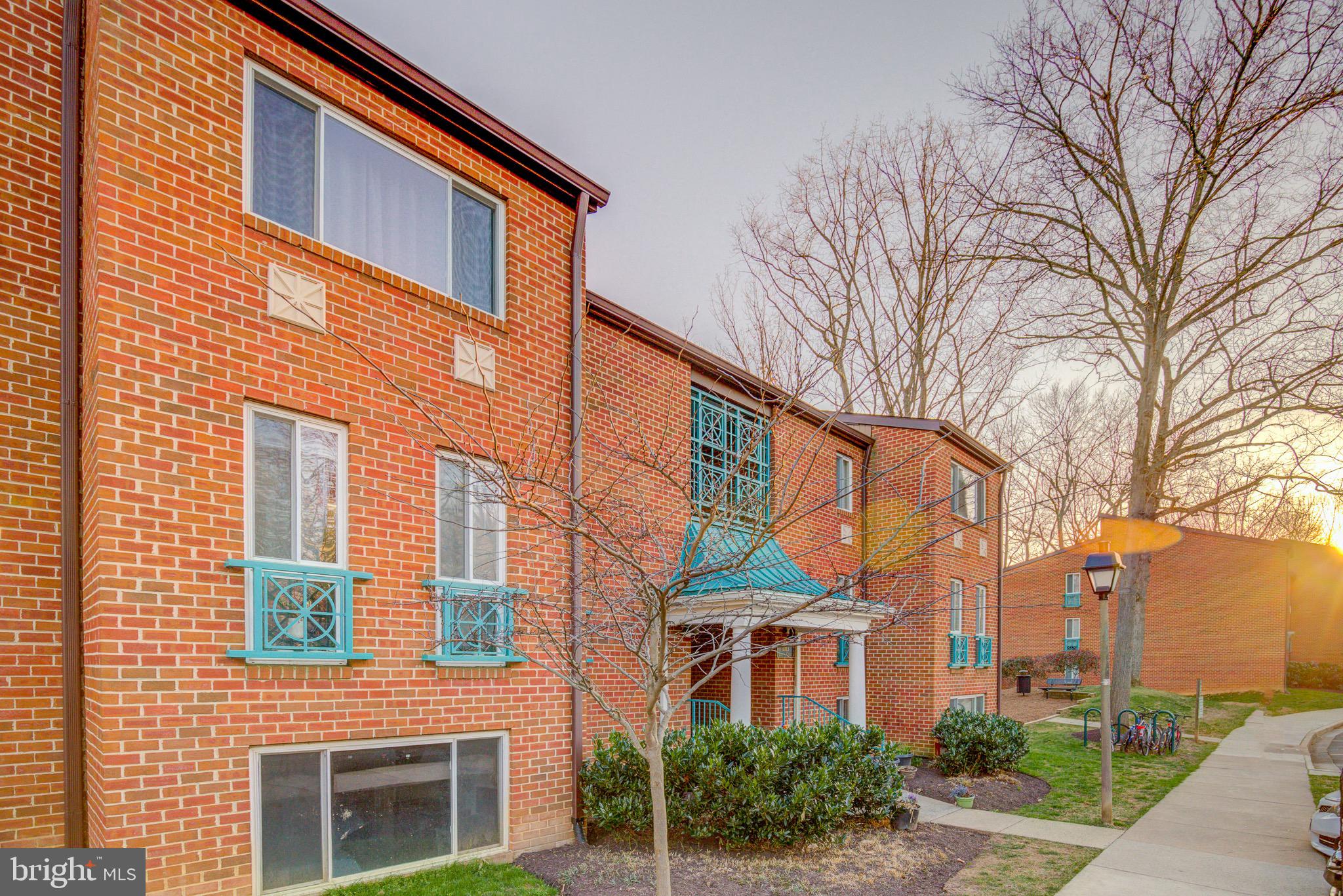 11813 Breton Court, Unit 2B Reston, VA 20191 - Photo 15 of 17 a front view of a building with a yard