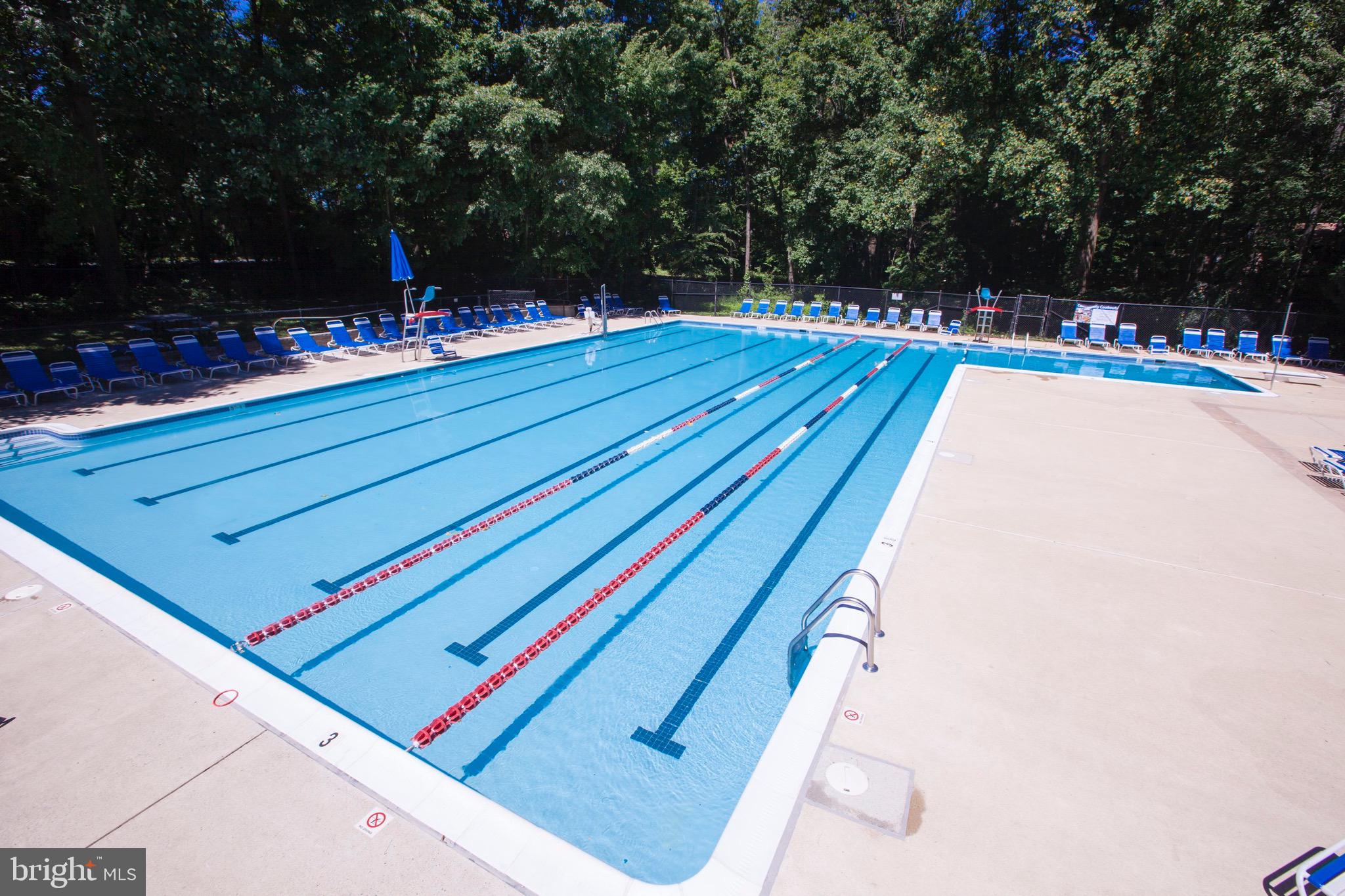 11813 Breton Court, Unit 2B Reston, VA 20191 - Photo 17 of 17 a swimming pool with wooden fence
