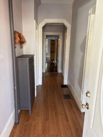 52 Harvest Street, Unit 1 Boston, MA 02125 - Photo 14 of 35 a view of a hallway view with wooden floor and staircase