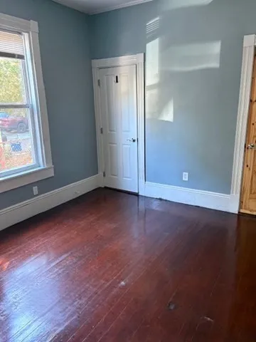 a living room with furniture and a lamp